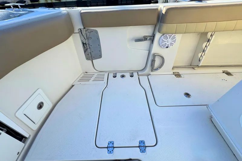 Slide: The Image of 2020 Sailfish 360 CC boat interior with ocean view, featuring seating and deck details. - 8