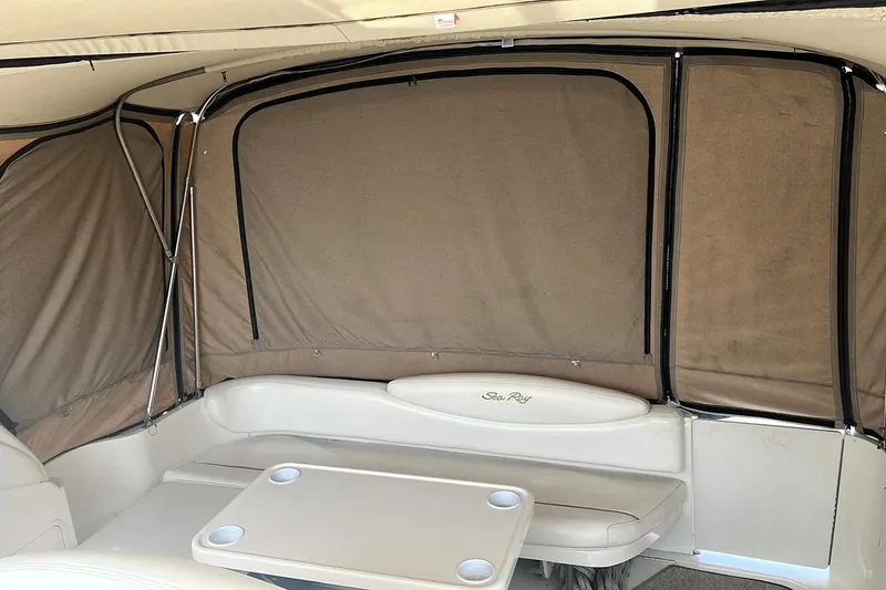 Slide: The Image of 2000 Sea Ray 340 Sundancer docked by a bridge on a sunny day. - 5