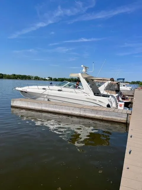 Slide: The Image of 2000 Sea Ray 340 Sundancer docked at a marina. - 7
