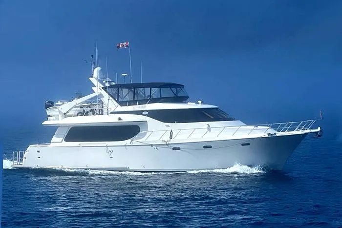 The Image of 2001 Symbol Raised Pilothouse Motoryacht cruising on calm blue waters. - 0
