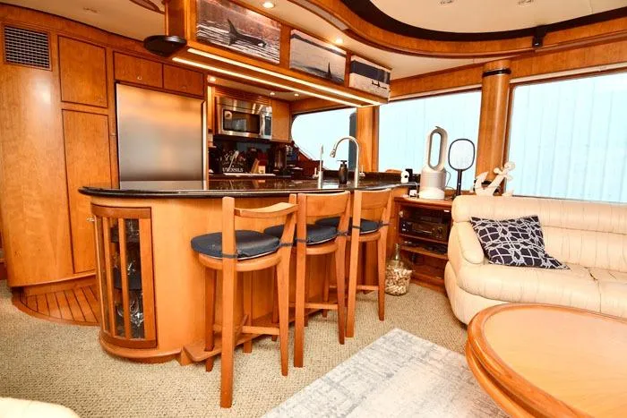 Slide: The Image of Luxurious 2001 Symbol Raised Pilothouse Motoryacht interior with elegant wood finishes and modern amenities. - 12