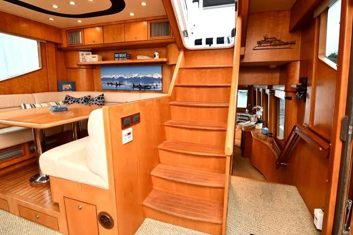 Slide: The Image of Interior of 2001 Symbol Raised Pilothouse Motoryacht with wooden stairs and seating area. - 15