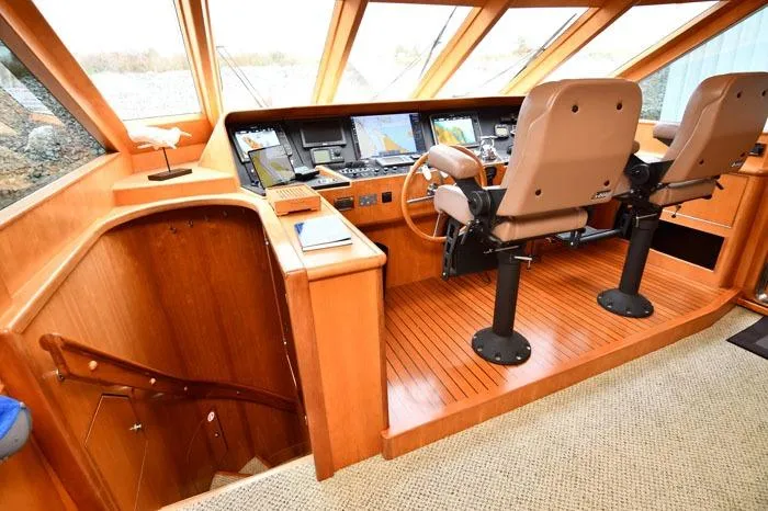 Slide: The Image of Pilothouse interior of 2001 Symbol Raised Pilothouse Motoryacht with navigation equipment and seating. - 16