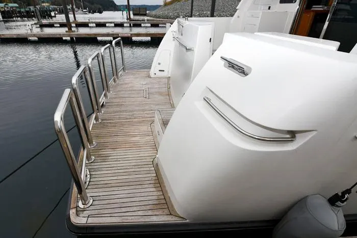 Slide: The Image of Stern view of 2001 Symbol Raised Pilothouse Motoryacht at dock. - 2