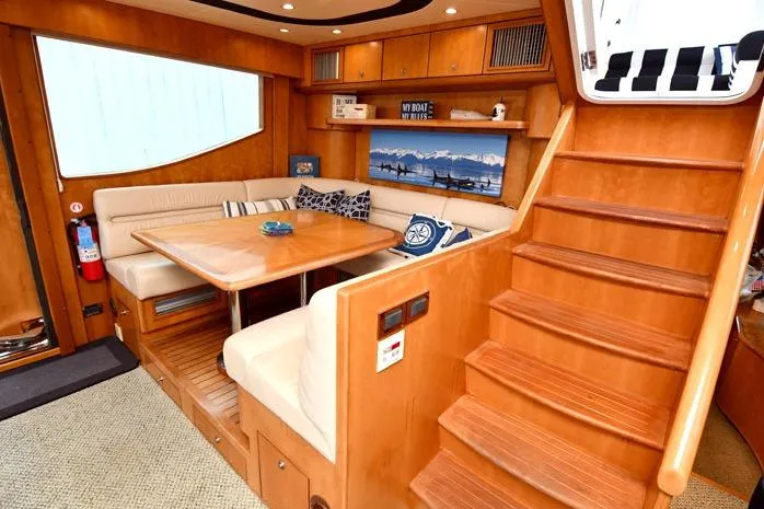 Slide: The Image of Luxurious 2001 Symbol Raised Pilothouse Motoryacht interior with wooden staircase and cozy dining area. - 21