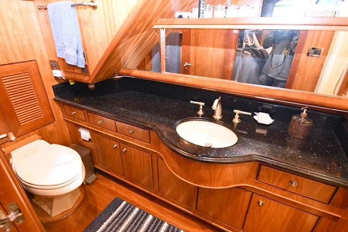Slide: The Image of Luxurious bathroom in 2001 Symbol Raised Pilothouse Motoryacht with elegant wood cabinetry. - 32