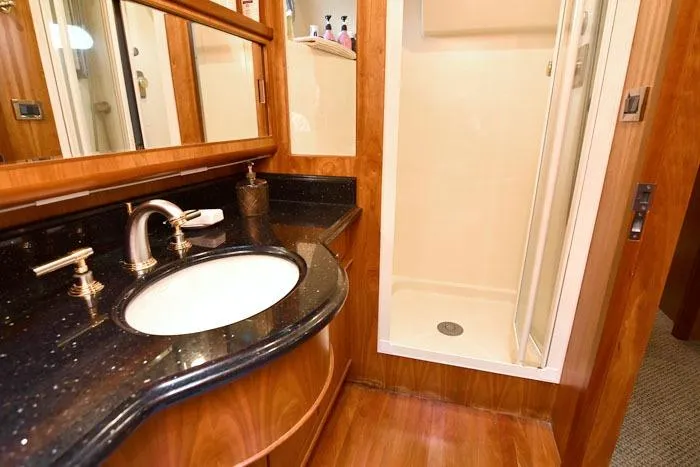 Slide: The Image of Luxurious bathroom in 2001 Symbol Raised Pilothouse Motoryacht with elegant fixtures and wood accents. - 33
