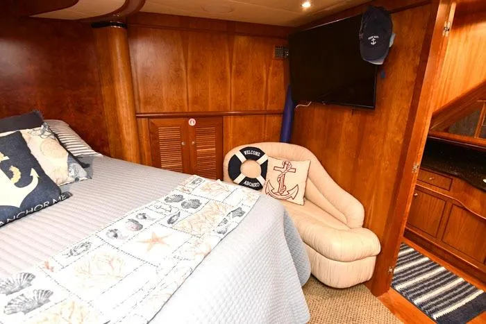 Slide: The Image of Luxurious 2001 Symbol Raised Pilothouse Motoryacht cabin with nautical decor and cozy seating. - 39