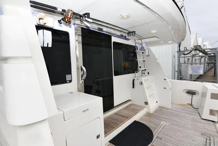 Slide: The Image of 2001 Symbol Raised Pilothouse Motoryacht deck with modern amenities and sleek design. - 4