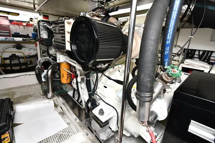 Slide: The Image of Engine room of a 2001 Symbol Raised Pilothouse Motoryacht, showcasing detailed machinery and components. - 41
