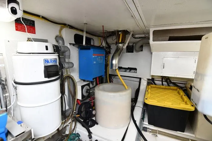 Slide: The Image of Engine room of 2001 Symbol Raised Pilothouse Motoryacht with equipment and storage. - 43