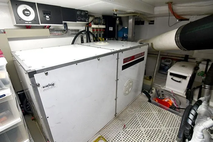 Slide: The Image of Engine room of 2001 Symbol Raised Pilothouse Motoryacht with generator and equipment. - 44