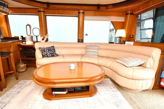 Slide: The Image of Luxurious interior of 2001 Symbol Raised Pilothouse Motoryacht with plush seating and wooden accents. - 8