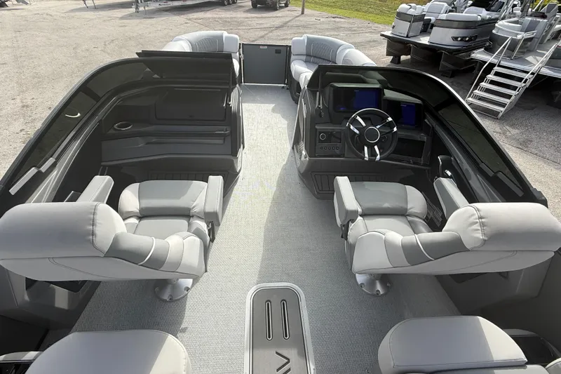 Slide: The Image of 2026 Avalon 2585 Excalibur LTD boat interior with quad loungers and modern helm. - 12