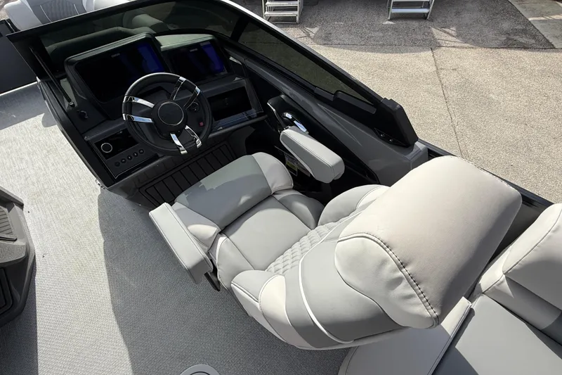 Slide: The Image of Luxurious helm of 2026 Avalon 2585 Excalibur LTD with modern controls and plush seating. - 27