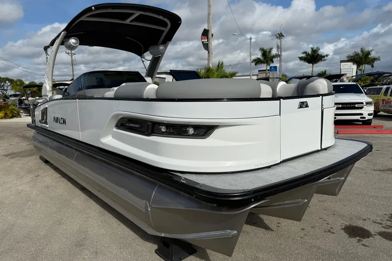 Slide: The Image of 2026 Avalon 2585 Excalibur LTD pontoon boat with Mercury V-10 motor, sleek design. - 4