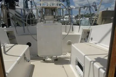 Slide: The Image of 1979 Tartan T 37 sailboat cockpit with steering wheel and seating. - 14