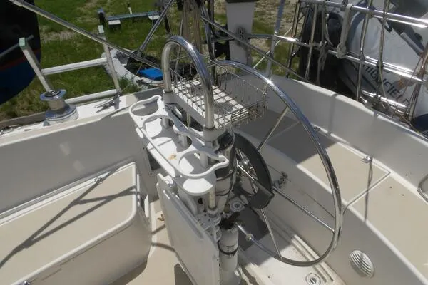Slide: The Image of Cockpit of 1979 Tartan T 37 sailboat with steering wheel and cup holders. - 15