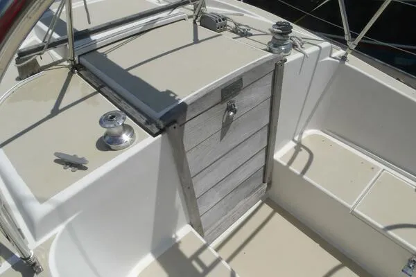 Slide: The Image of 1979 Tartan T 37 sailboat cockpit with winches and wooden hatch. - 16