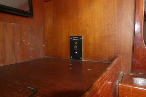 Slide: The Image of Wooden interior of 1979 Tartan T 37 sailboat with control panel. - 25