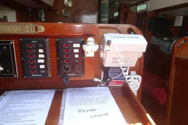 Slide: The Image of Interior of a 1979 Tartan T 37 sailboat with control panels and navigation equipment. - 32
