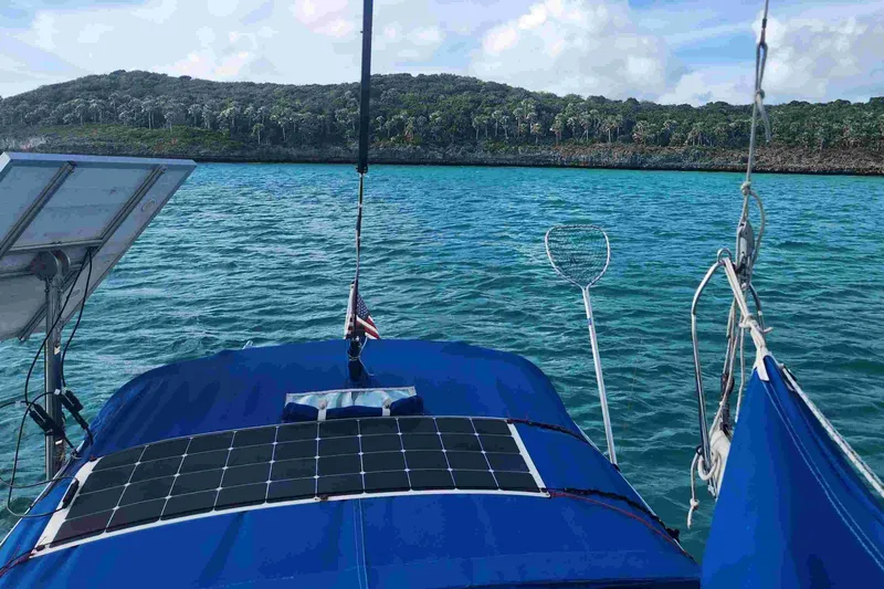 Slide: The Image of Sailboat with solar panel on blue water, Tartan T 37, 1979 model. - 36