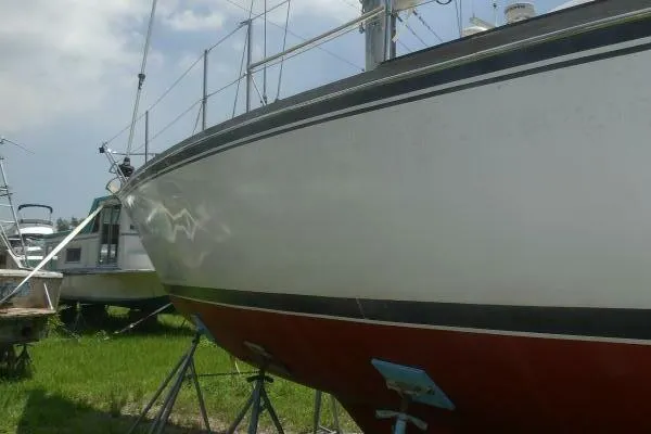 Slide: The Image of 1979 Tartan T 37 sailboat on stands, side view, outdoors. - 39