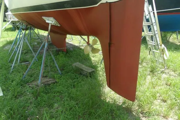 Slide: The Image of 1979 Tartan T 37 sailboat on stands, showing rudder and propeller. - 42