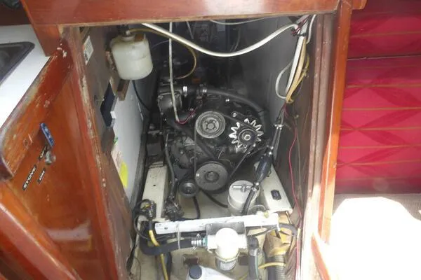 Slide: The Image of Engine compartment of a 1979 Tartan T 37 sailboat, showcasing mechanical components. - 43