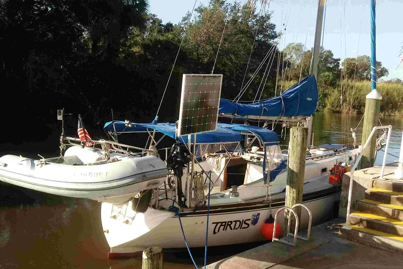 Slide: The Image of 1979 Tartan T 37 sailboat docked with solar panel and inflatable dinghy. - 5
