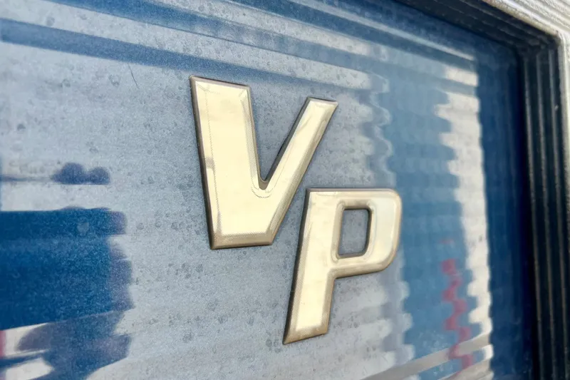 Slide: The Image of Close-up of 'VP' emblem on 2018 Manitou 23 Aurora LE boat. - 10