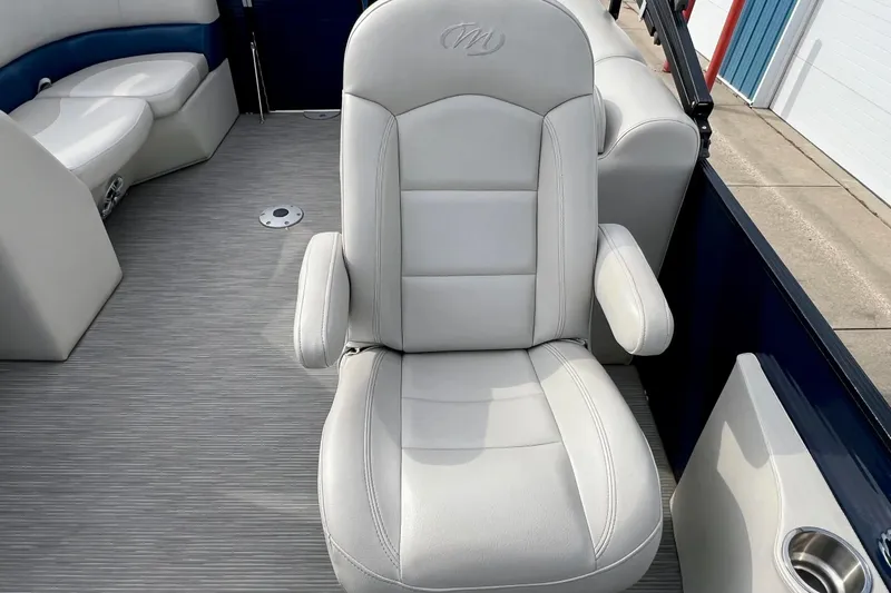 Slide: The Image of 2018 Manitou 23 Aurora LE boat interior with plush seating and modern design. - 19