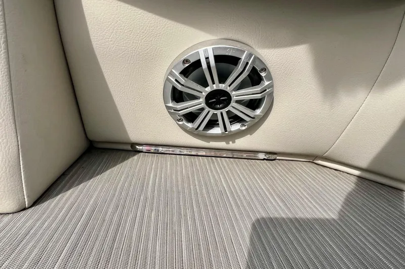 Slide: The Image of Speaker and seating detail in 2018 Manitou 23 Aurora LE boat interior. - 29