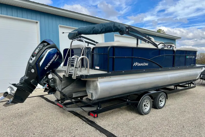 Slide: The Image of 2018 Manitou 23 Aurora LE pontoon boat with Evinrude outboard motor on trailer. - 3