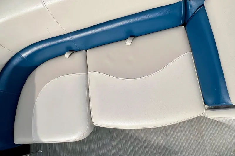 Slide: The Image of 2018 Manitou 23 Aurora LE boat seating with blue and white upholstery. - 35