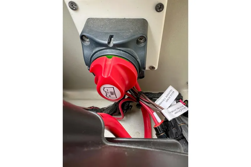 Slide: The Image of Red battery switch in 2018 Manitou 23 Aurora LE boat, with labeled wiring. - 40