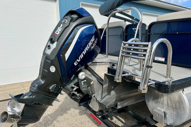 Slide: The Image of 2018 Manitou 23 Aurora LE with Evinrude outboard motor and stainless steel ladder. - 5