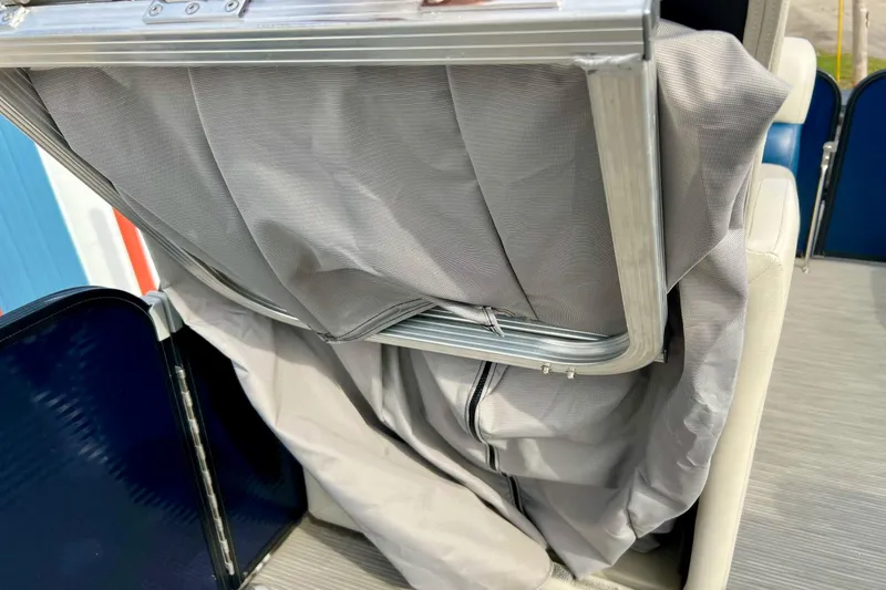 Slide: The Image of 2018 Manitou 23 Aurora LE boat seat with folded gray fabric cover. - 51