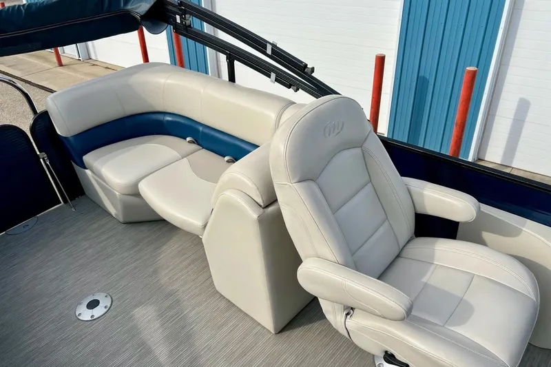 Slide: The Image of 2018 Manitou 23 Aurora LE boat interior with plush seating and modern design. - 52