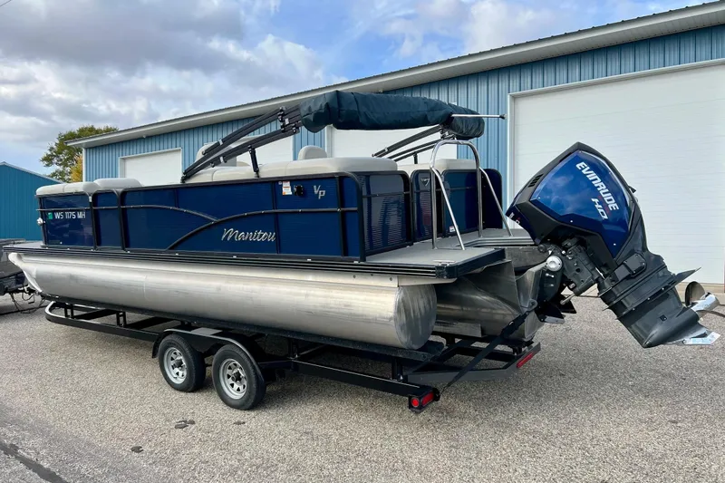 Slide: The Image of 2018 Manitou 23 Aurora LE pontoon boat with Evinrude engine on trailer. - 58