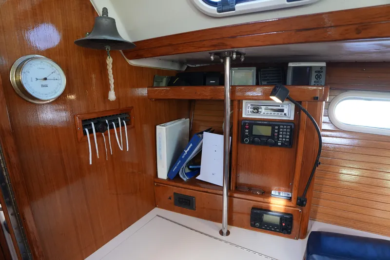 Slide: The Image of Interior of 2002 Catalina 42 Mark II sailboat with navigation equipment and wooden finish. - 19