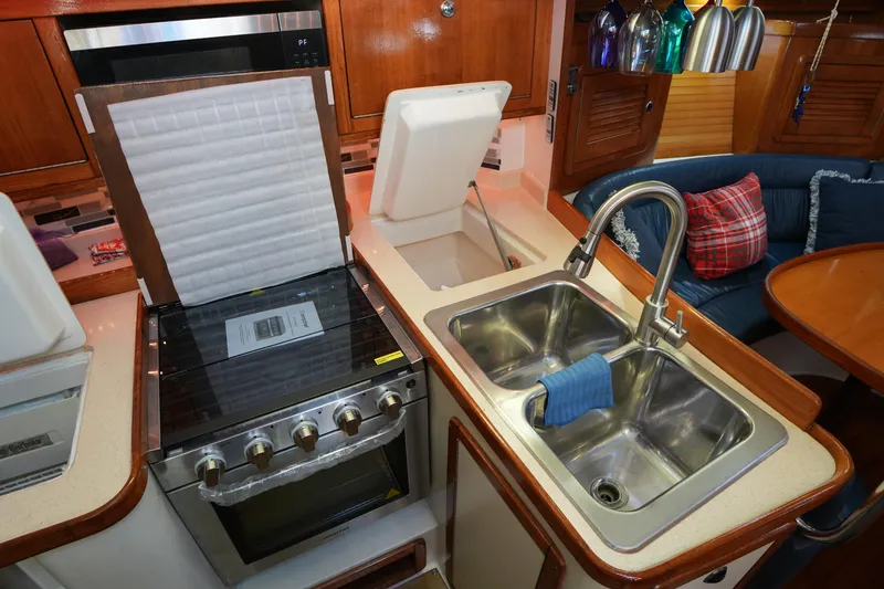 Slide: The Image of Galley kitchen in 2002 Catalina 42 Mark II yacht with stove and double sink. - 22