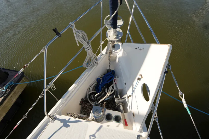 Slide: The Image of Bow of 2002 Catalina 42 Mark II sailboat with anchor and ropes. - 7