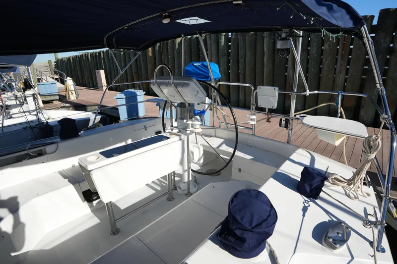 Slide: The Image of Cockpit of 2002 Catalina 42 Mark II sailboat with steering wheel and seating. - 8