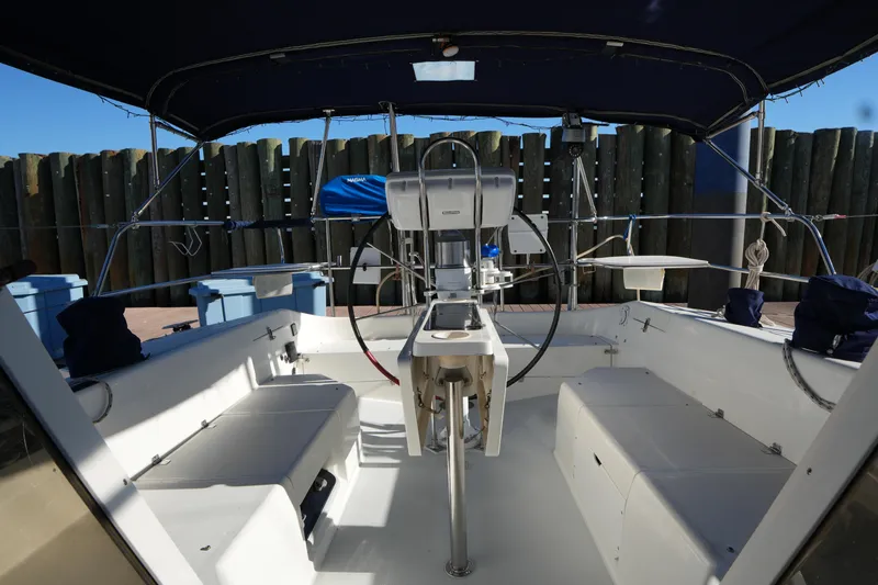Slide: The Image of Cockpit of 2002 Catalina 42 Mark II sailboat with steering wheel and seating. - 11