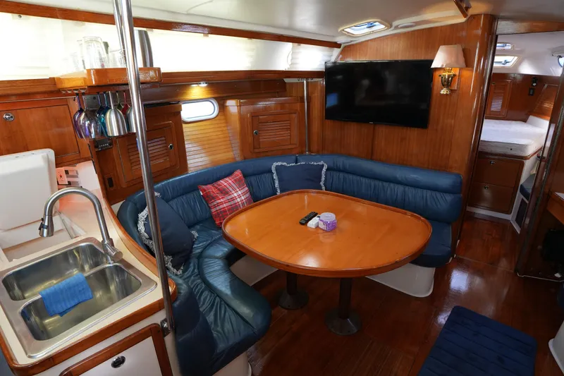 Slide: The Image of Interior of 2002 Catalina 42 Mark II yacht with cozy seating and modern amenities. - 17