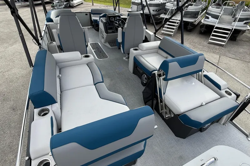 Slide: The Image of 2026 Avalon 2385 Catalina Quad Lounger, Tri Toon boat interior with blue and gray seating. - 12