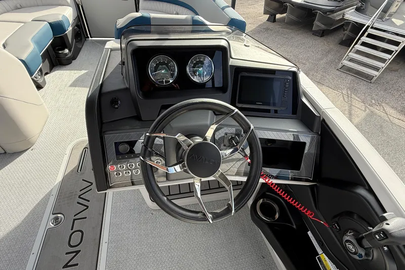 Slide: The Image of Steering console of 2026 Avalon 2385 Catalina Quad Lounger, featuring modern controls and dashboard. - 25