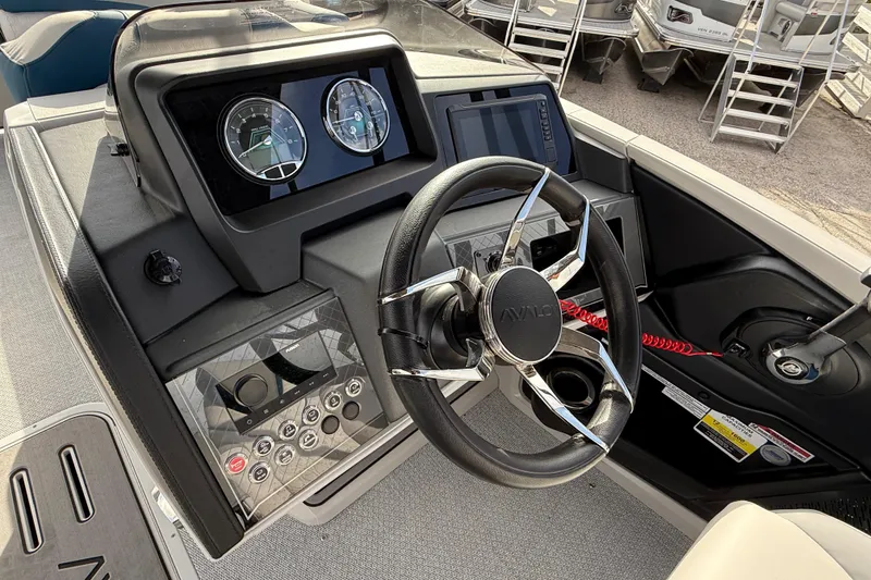 Slide: The Image of Steering console of 2026 Avalon 2385 Catalina Quad Lounger, featuring modern controls and gauges. - 26