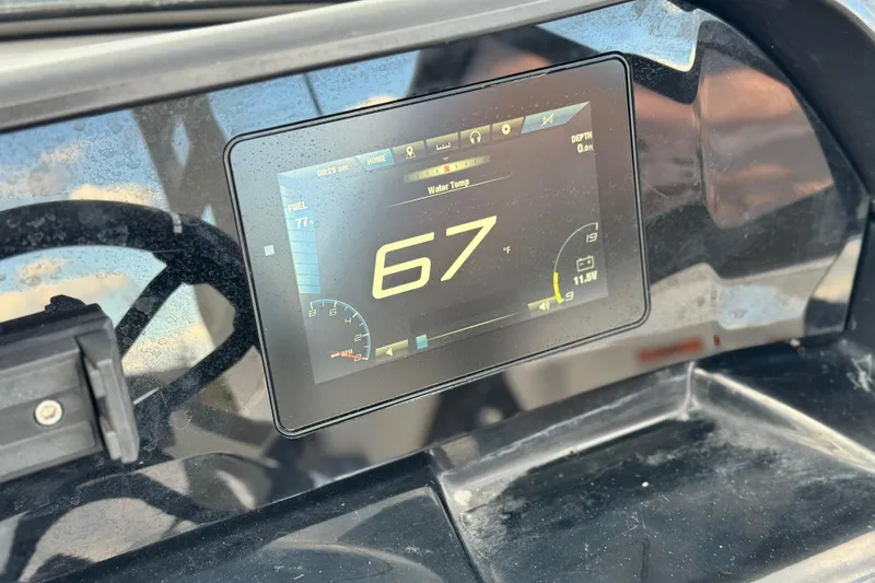 Slide: The Image of Dashboard of 2021 Yamaha Boats 195S showing digital display with temperature reading. - 25